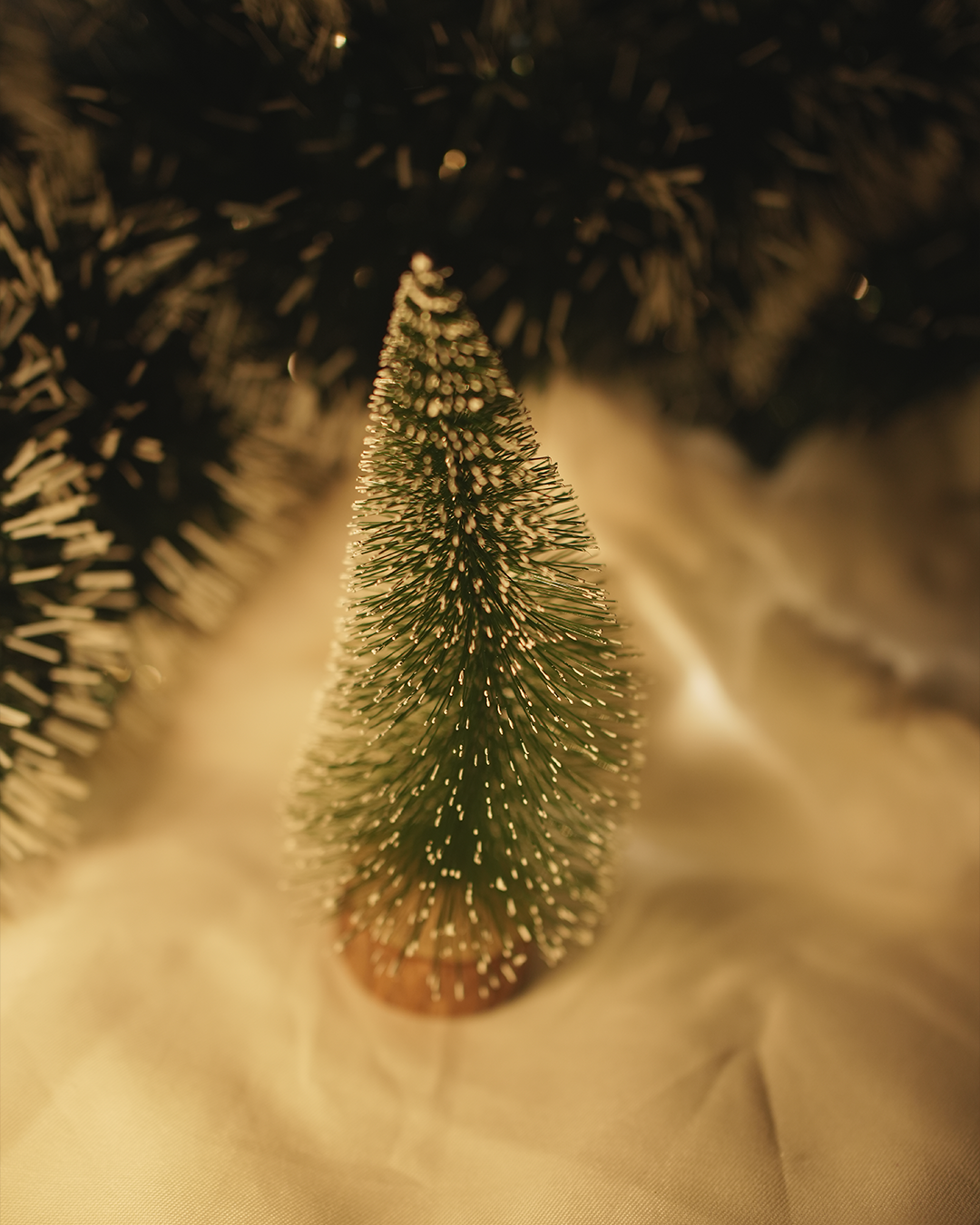 Miniature Christmas tree with gold accents