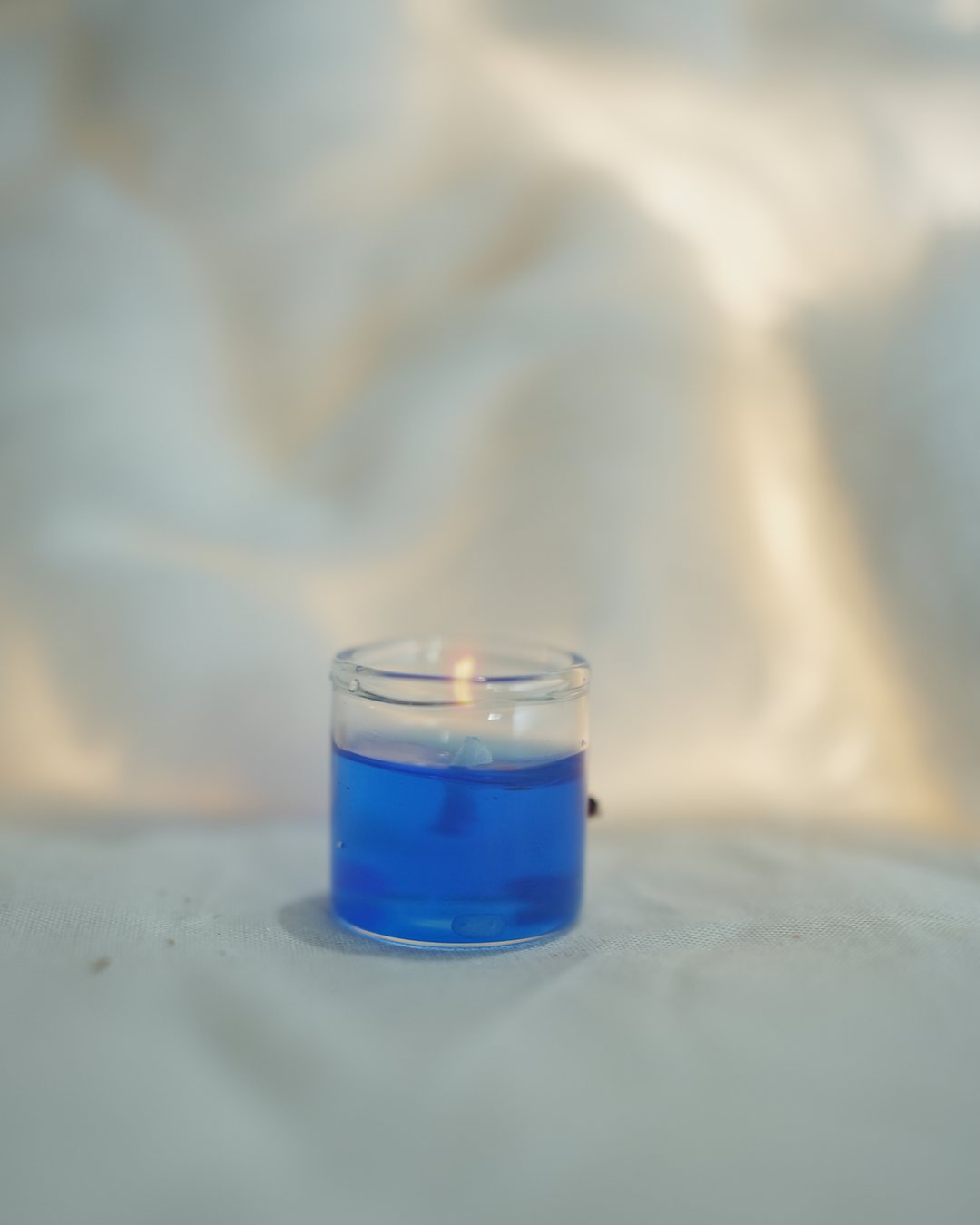 Tiny blue gel wax candle, perfect for home decor and Christmas gifting.