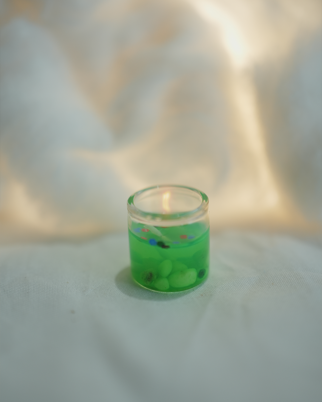Tiny green gel wax candle, perfect for home decor and Christmas gifting.