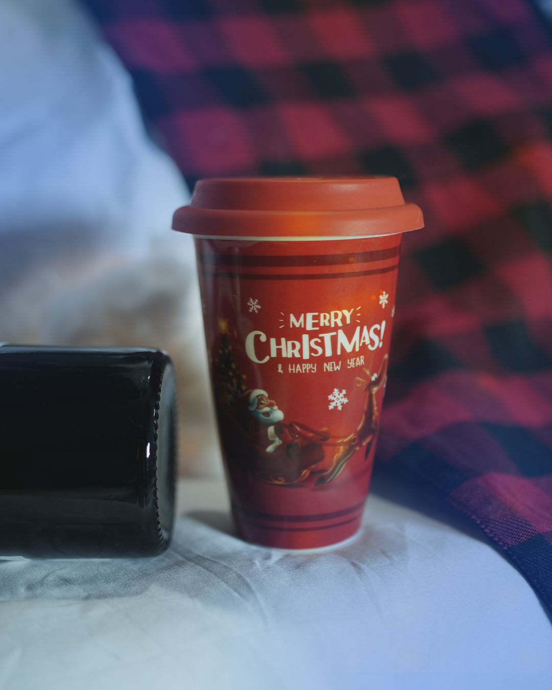 Festive red ceramic mug with a lid, featuring Santa Claus flying with reindeer and the text 'Merry Christmas! & Happy New Year'

Christmas mug, holiday mug, ceramic mug, gift mug, Santa mug, red mug