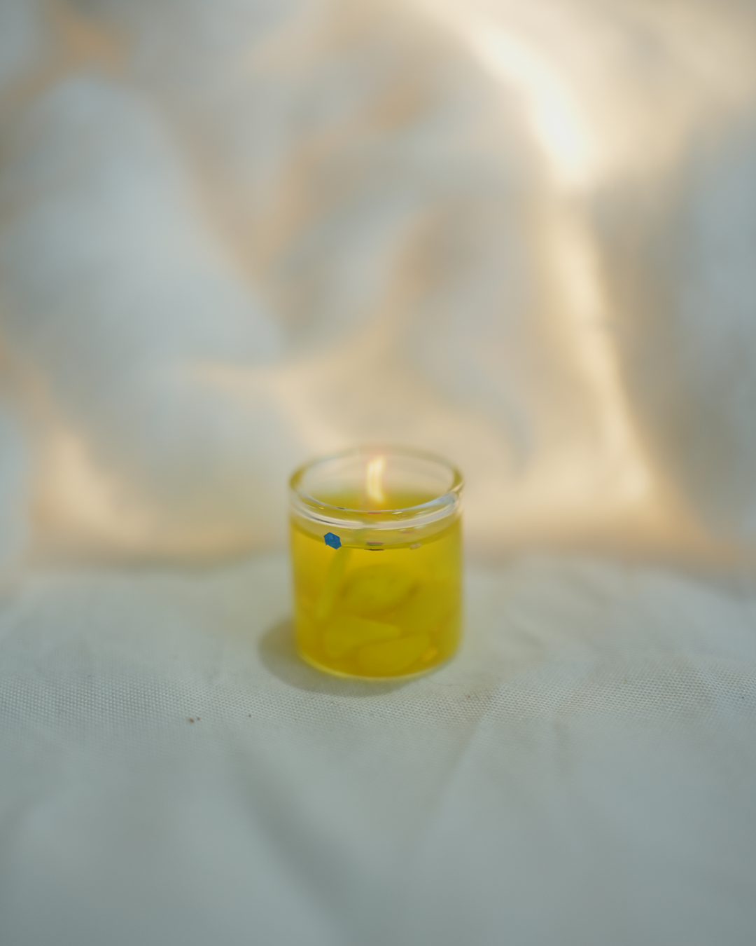 Tiny yellow gel wax candle, perfect for home decor and Christmas gifting.